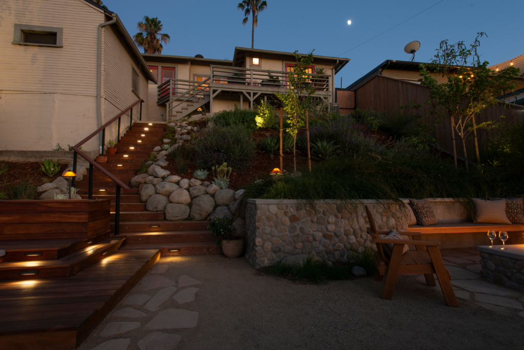 Outdoor lighting lights stairs of Craftsman home in Los Angeles.